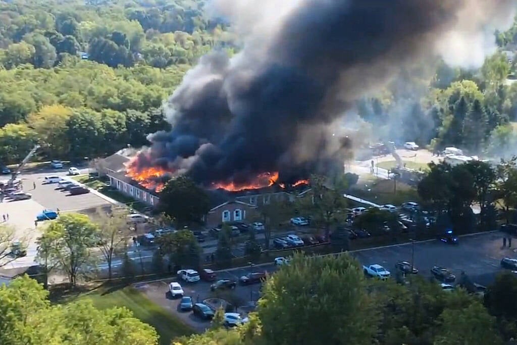 Two dead and eight injured in shooting and fire at Michigan church, say police