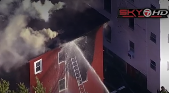 Crews respond to fire at triple decker in Malden